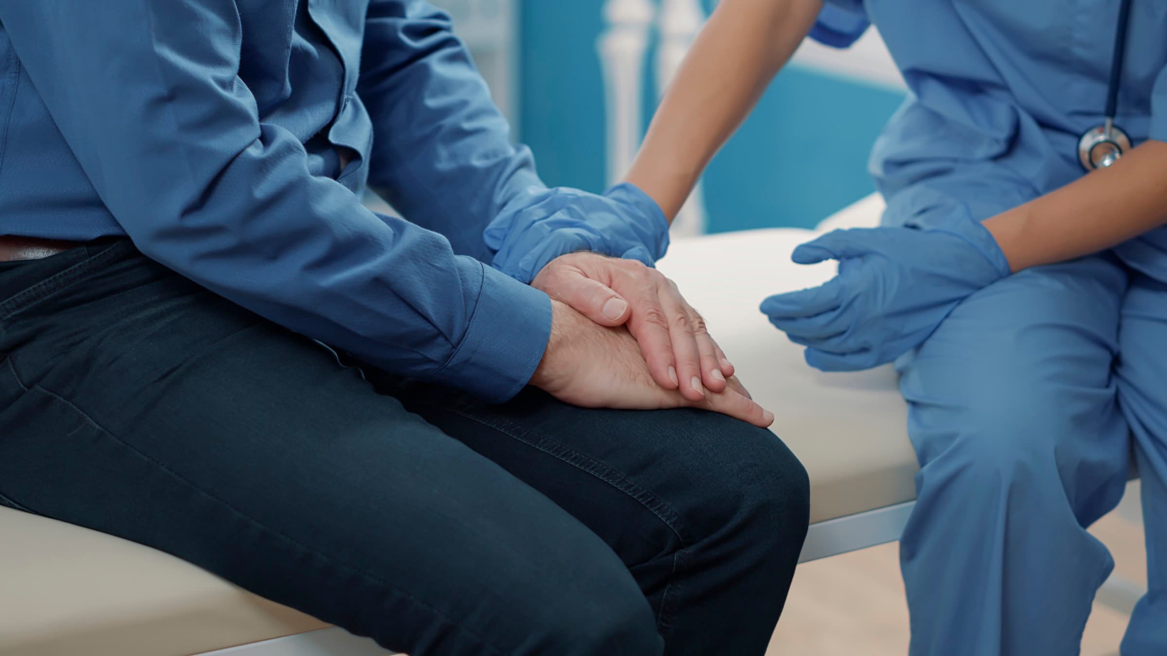 A care worker supporting a patient during recovery